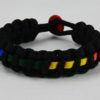 black lgbtq support paracord bracelet with rainbow line and red button in the back