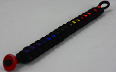 black lgbtq support paracord bracelet with red button in the bottom corner and rainbow line