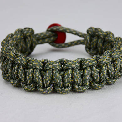 acu camouflage paracord bracelet unity band with red button back, picture of an acu camouflage paracord bracelet unity band with red button fastener in the back on a white background