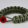 acu camouflage paracord bracelet unity band with red button in front, picture of an acu camouflage paracord bracelet unity band with red button fastener in the front of a white background