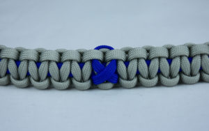 blue and grey anti bullying paracord bracelet with blue ribbon in the center