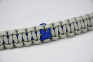 blue and grey anti-bullying paracord bracelet with blue ribbon in the center, picture of a blue and grey anti-bullying paracord bracelet unity band with a blue ribbon in the center of the bracelet