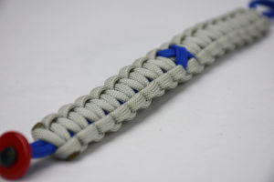 blue and grey anti-bullying paracord bracelet with blue ribbon and red button, paracord bracelet, blue and grey anti-bullying paracord bracelet unity band with red button fastener in the corner