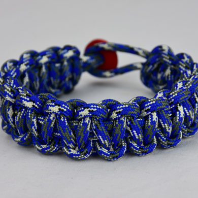 blue camouflage paracord bracelet unity band with red button in back, picture of a blue camouflage paracord bracelet unity band with red button fastener in the back on a white background
