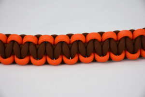 brown orange and brown paracord bracelet unity band across the center of a white background