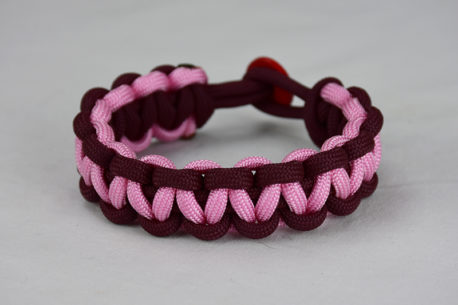 burgundy burgundy and soft pink paracord bracelet unity band with red button back, picture of a burgundy burgundy and soft pink paracord bracelet unity band with red button fastener in the back on a white background