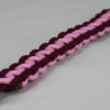 burgundy burgundy and soft pink paracord bracelet unity band with red button in the front corner on a white background, picture of a burgundy burgundy and soft pink paracord bracelet unity band with red button fastener on a white background