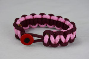 burgundy burgundy and soft pink paracord bracelet unity band with red button front, picture of a burgundy burgundy and soft pink paracord bracelet unity band with red button fastener in the front on a white background