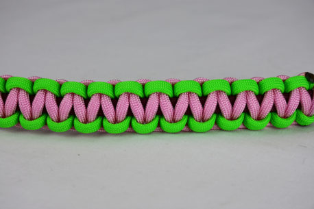 burgundy neon green and soft pink paracord bracelet unity band across the center of a white background