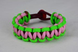burgundy neon green and soft pink paracord bracelet unity band with red button back, picture of a burgundy neon green and soft pink paracord bracelet unity band with red button fastener on a white background