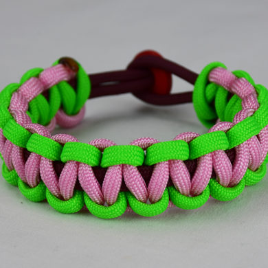 burgundy neon green and soft pink paracord bracelet unity band with red button back, picture of a burgundy neon green and soft pink paracord bracelet unity band with red button fastener on a white background