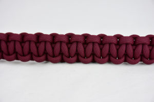burgundy paracord bracelet unity band across the center of a white background