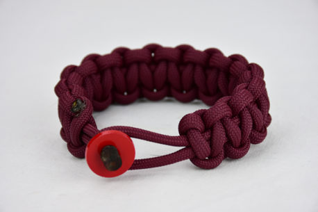burgundy paracord bracelet unity band with red button in front, picture of a burgundy paracord bracelet unity band with red button fastener