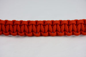 burnt orange paracord bracelet unity band in the center of a white background