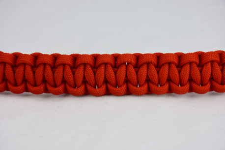 burnt orange paracord bracelet unity band in the center of a white background