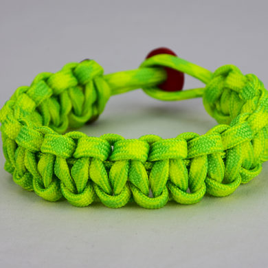 dayglow camouflage paracord bracelet unity band with red button in the back, picture of a dayglow camouflage paracord bracelet with red button fastener in the back on a white background