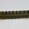 desert foliage camouflage paracord bracelet going across the middle of a white background