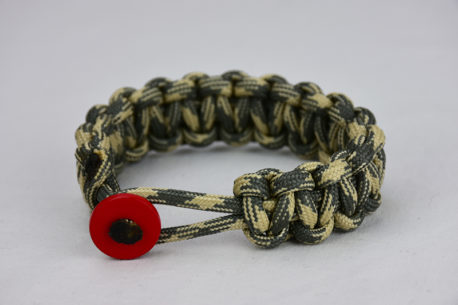 desert sand foliage camouflage paracord bracelet with red button in the front, picture of a desert sand foliage camouflage paracord bracelet with red button fastener in the front on a white background