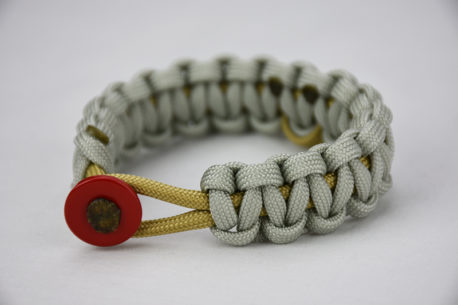 gold and grey pediatric cancer support paracord bracelet unity band, picture of a gold and grey pediatric cancer support paracord bracelet with a gold ribbon in the center and a red button fastener in the front