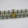 gold and grey pediatric cancer support paracord bracelet with gold ribbon in the center
