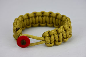 gold paracord bracelet unity band with red button, picture of a gold paracord bracelet with a red button fastener in the front