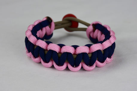 gold soft pink and navy blue paracord bracelet unity band with red button back, picture of a gold soft pink and navy blue paracord bracelet unity band with red button fastener in the back of a white background
