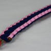 gold soft pink and navy blue paracord bracelet unity band with red button fastener in the front corner
