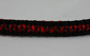 grey black red and black camouflage machine gun kelly paracord bracelet across the center of a white background