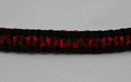 grey black red and black camouflage machine gun kelly paracord bracelet across the center of a white background