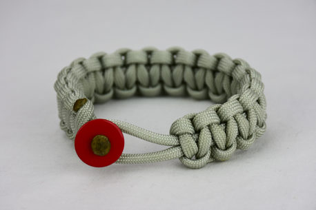 grey paracord bracelet unity band with red button front, picture of a grey paracord bracelet unity band with red button fastener in the front on a white background