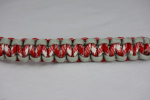 grey red and white camouflage and grey paracord bracelet unity band across the center of a white background