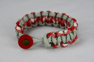grey red and white camouflage and grey paracord bracelet unity band with red button front on a white background