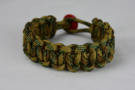 multicam camouflage paracord bracelet unity band with red button in back, picture of a multicam camouflage paracord bracelet unity band with red button fastener in the back on a white background