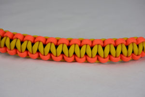 navy blue neon orange and yellow paracord bracelet unity band across the center of a white background