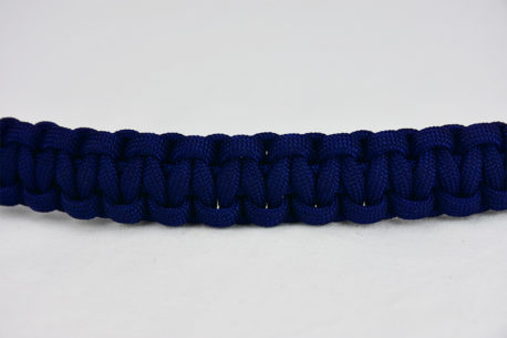 navy blue paracord bracelet unity band across the center of a white background, navy blue paracord bracelet