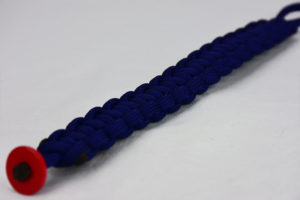 navy blue paracord bracelet unity band with a red button, picture of a navy blue paracord bracelet with a red button fastener in the front corner