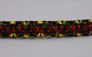 neon green black and yellow camouflage red and black camouflage rasta paracord bracelet across the center