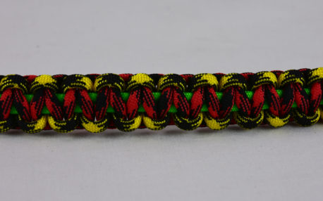 neon green black and yellow camouflage red and black camouflage rasta paracord bracelet across the center