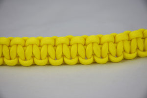 neon yellow paracord bracelet going across the center of the picture, neon yellow paracord bracelet unity band