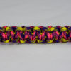 neon yellow purple and yellow camouflage pink and purple camouflage paracord bracelet unity band across the center of a white background