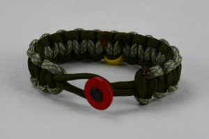 od green acu camouflage od green military support paracord bracelet with red button in front and yellow ribbon