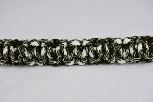 od green and white camouflage paracord bracelet unity band across the center of a white background