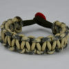 od green desert sand foliage camouflage and desert sand paracord bracelet unity band with red button in the back, picture of an od green desert sand foliage camouflage desert sand paracord bracelet unity band with red button fastener in the back on a white background