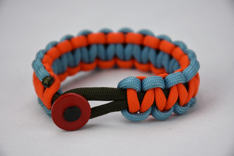 od green light blue and orange paracord bracelet with red button in front, picture of a od green light blue and orange paracord bracelet unity band with red button fastener in the front on a white background