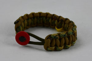 od green multicam camouflage and coyote brown military support paracord bracelet with red button fastener in the front and yellow ribbon