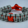orange and grey leukemia support paracord bracelet with red button back and orange ribbon