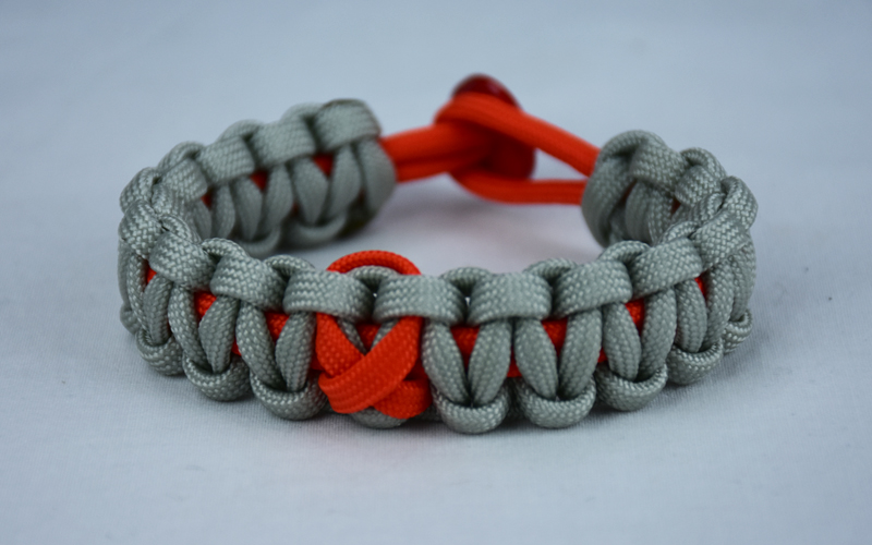 orange and grey leukemia support paracord bracelet with red button back and orange ribbon
