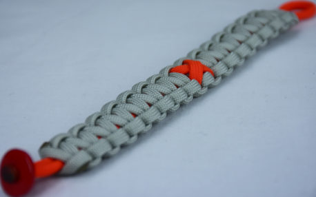 orange and grey leukemia support paracord bracelet with red button corner and orange ribbon