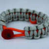 orange and grey leukemia support paracord bracelet with red button front and orange ribbon