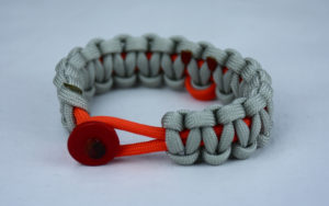 orange and grey leukemia support paracord bracelet with red button front and orange ribbon
